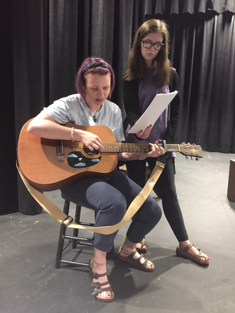 Student practicing guitar