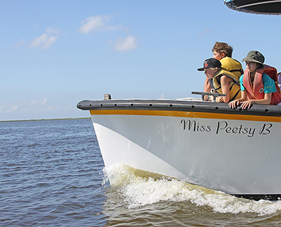 kids on peetsy boat